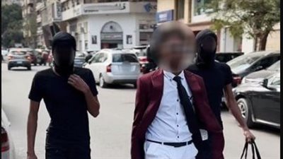 القبض على المتهمين بارتداء أقنعة للوجه والسير بأحد شوارع الجيزة